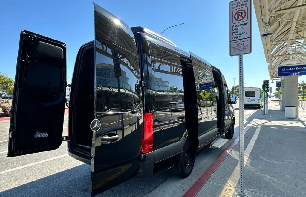 Mercedes Sprinter van at airport pickup area for Irvine airport transportation